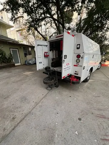 Magnet Plumbing service vehicle on-site for Grease Trap Cleaning in Westchase
